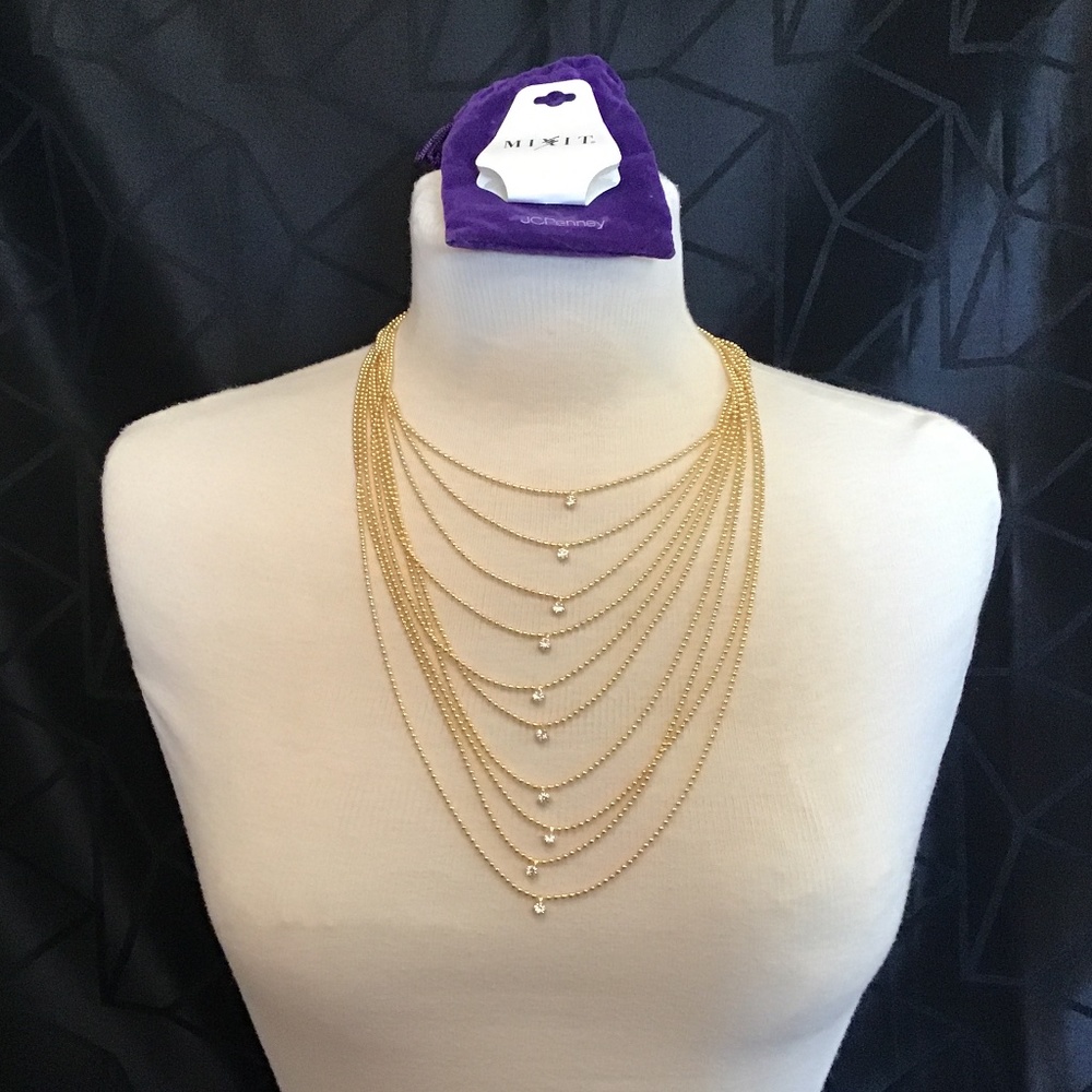 NWT  “Mixit”  Goldtone multi chain necklace with crystal bead on each chain